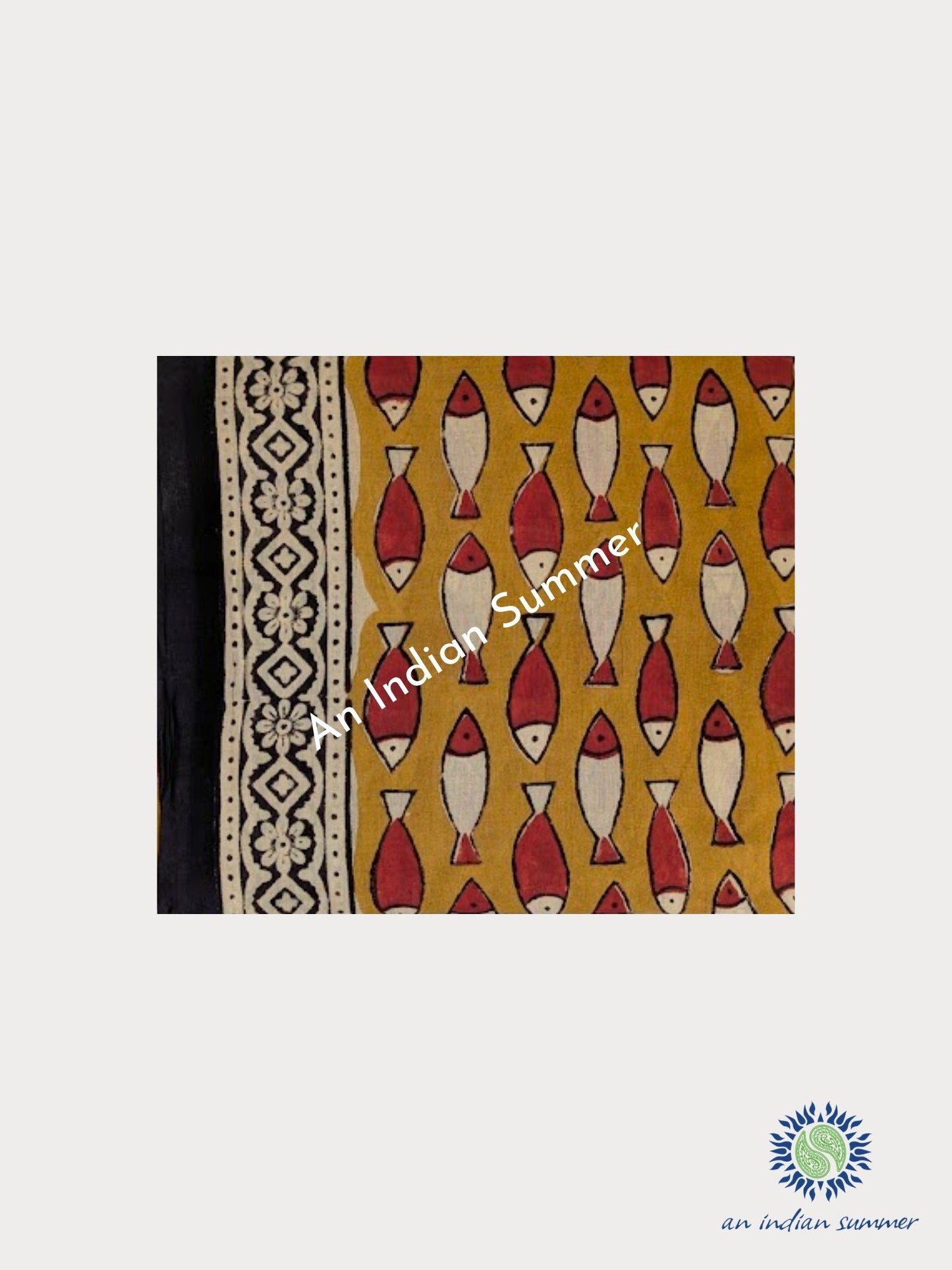 An Indian Summer natural dyed cotton sarong featuring a mustard yellow base with a repeating fish pattern in red and cream, plus a black and cream geometric border. Lightweight organic cotton natural fibres natural dyes plant-based dyes. 