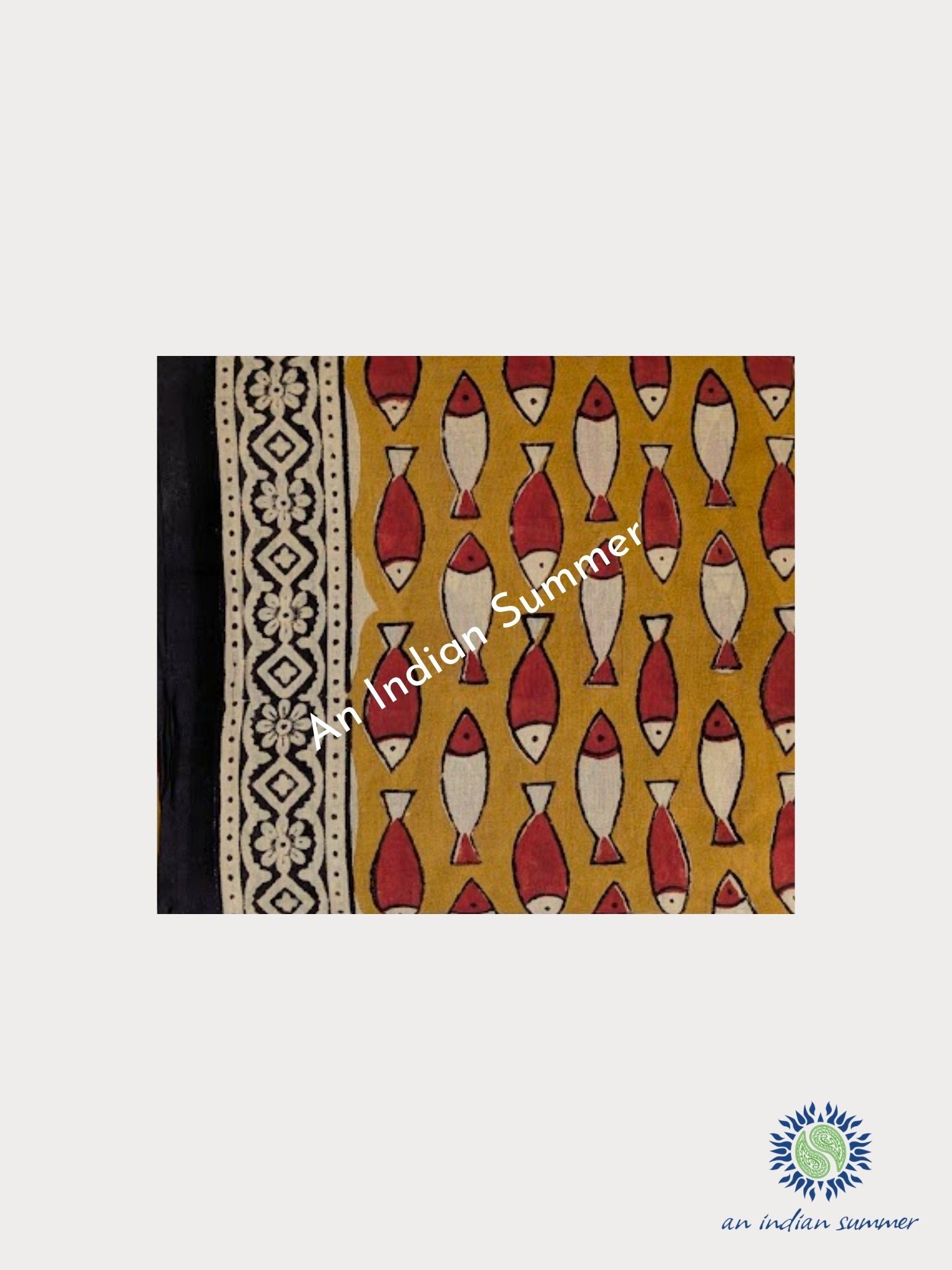 An Indian Summer natural dyed cotton sarong featuring a mustard yellow base with a repeating fish pattern in red and cream, plus a black and cream geometric border. Lightweight organic cotton natural fibres natural dyes plant-based dyes. 